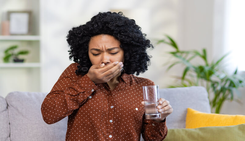 pregnant  woman having toxicosis vomit in apartment