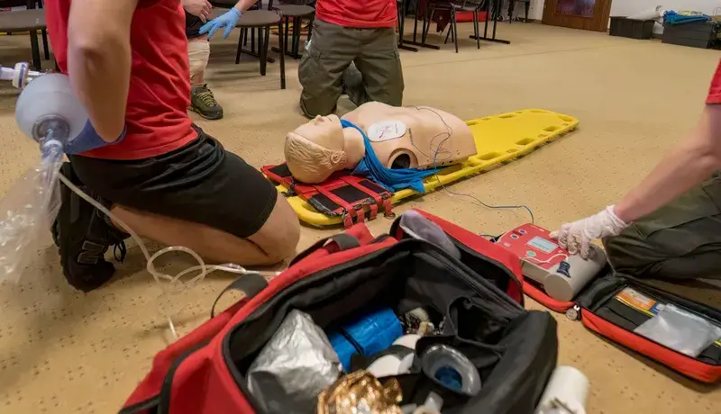 Tutor showing how to complete a CPR technique
