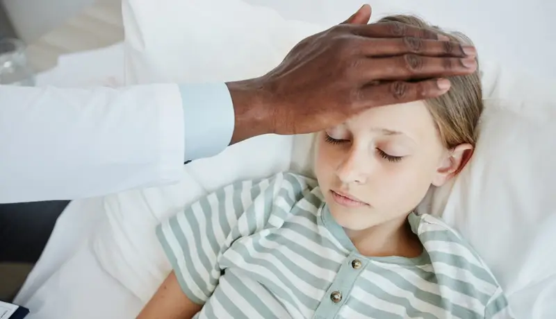 Doctor Caring for Child in Hospital Meningitis symptoms and treatment