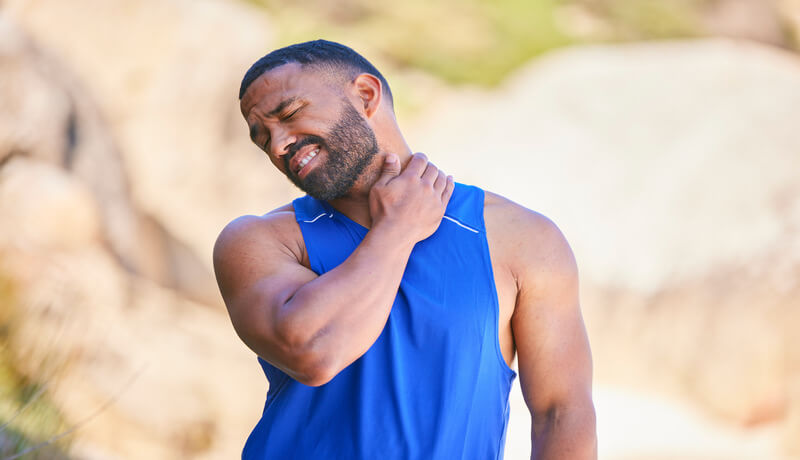 Neck pain, sport and man outdoor, accident and fitness exercise in training workout. Spine, injury