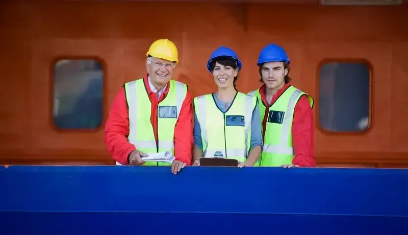 Happy seafarers in a dockyard