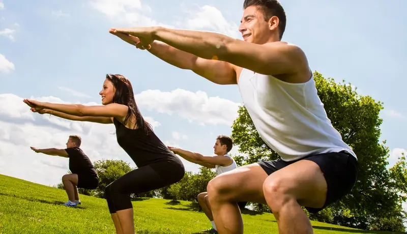 Personal trainers doing outdoor training in urban place