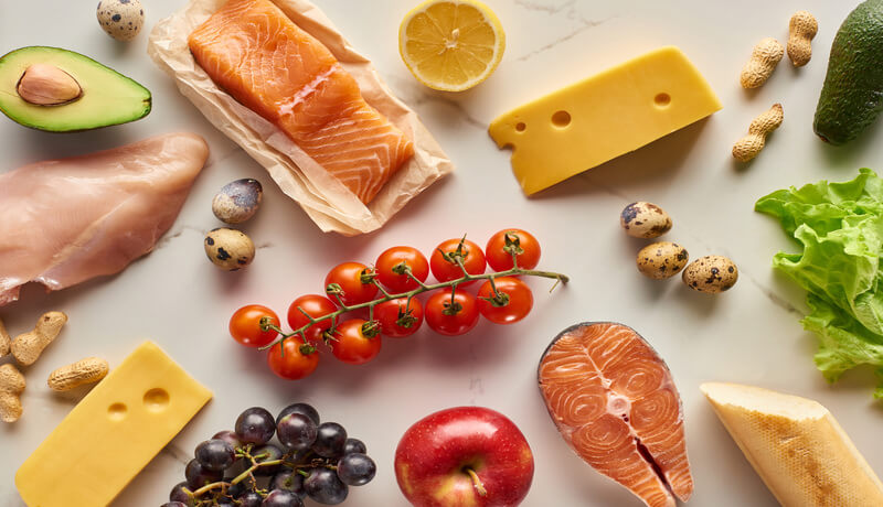 Raw Poultry And Fish With Avocados, Lemon, Cheese, Eggs, Grapes, Cherry Tomatoes, Peanuts And Apples