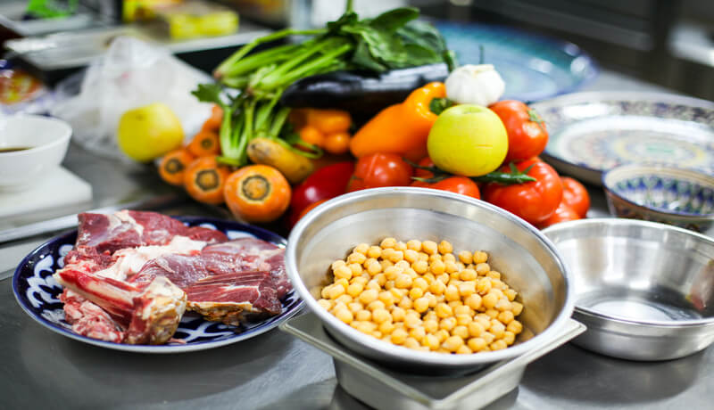 The picture shows vegetables and a lamb on plates which are a good and healthy choice