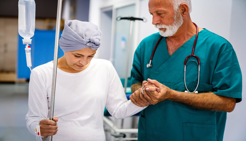 Woman with cancer during chemotherapy recovering from illness in hospital