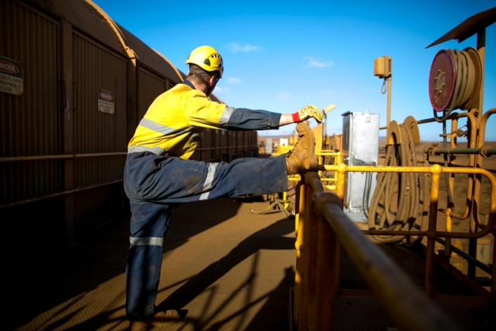A maritime worker stretching