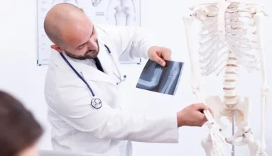 HOMED Maritime Medics School: A doctor showing elbow joint on skeleton, compairing it to an elbow x-ray, for education of a trainee